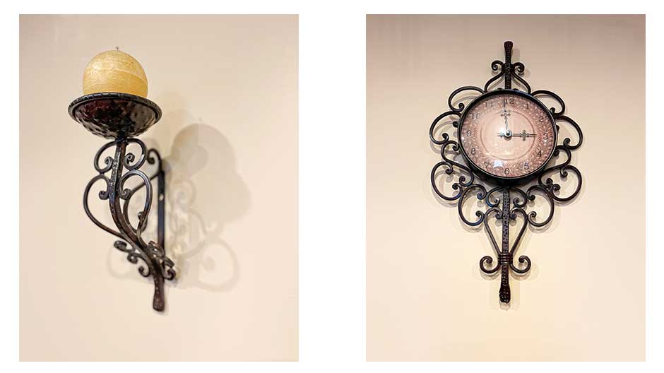 clock and candle holders with metal scrolls